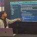 Bayu Fedra melakukan pesentasi hasil penelitiannya di Black Hat Europe. Foto: Ist.